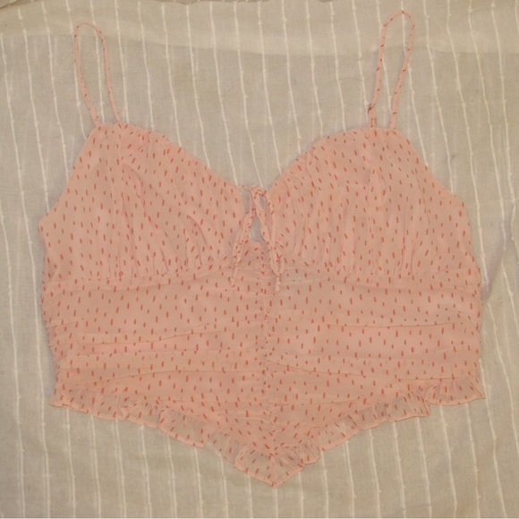 Light pink spotted tank top. Ruched mid section with adjustable straps and tie - Picture 3 of 5